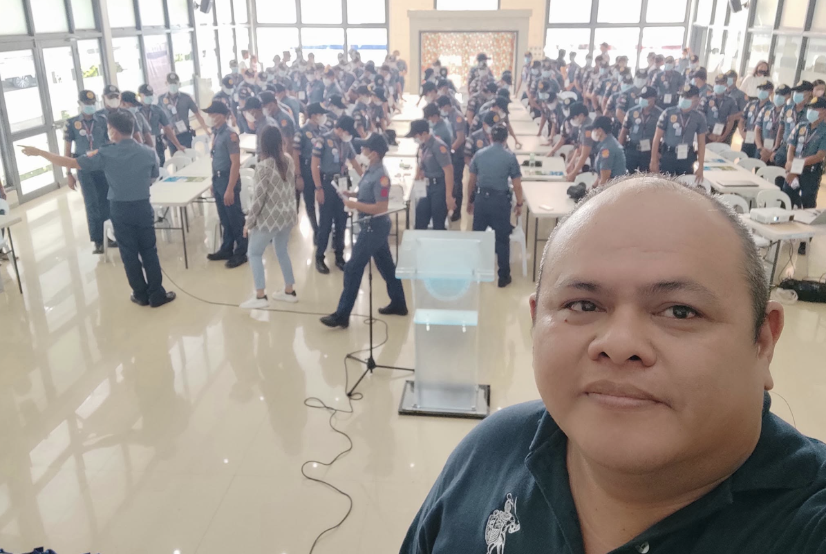 Ferdie Nervida with law enforcement officers at a training session