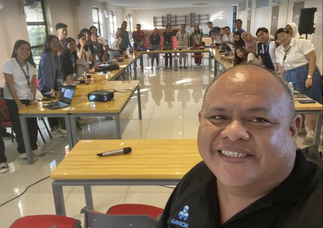 Ferdie Nervida with workshop participants after a training session